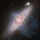 Illustration for article titled Spectacular View of Two Seemingly Colliding Galaxies Captured By Hubble